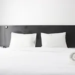 Monochrome Style Studio Room @Grand Asia Afrika Apartment By Travelio