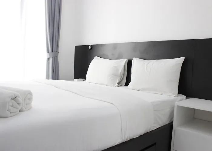 Monochrome Style Studio Room @Grand Asia Afrika Apartment By Travelio